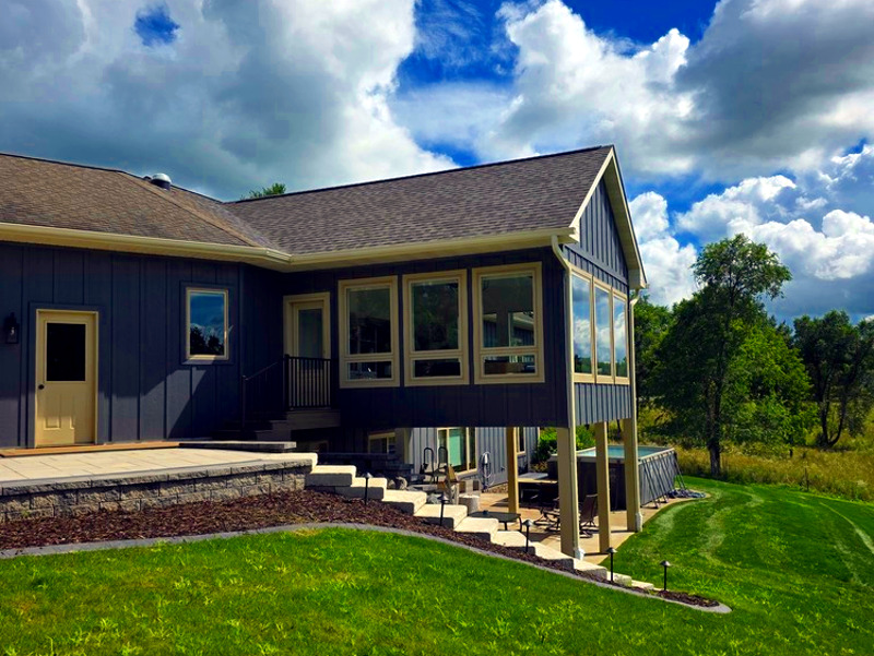 Licensed home addition contractors building a room addition on an Eau Claire, WI home